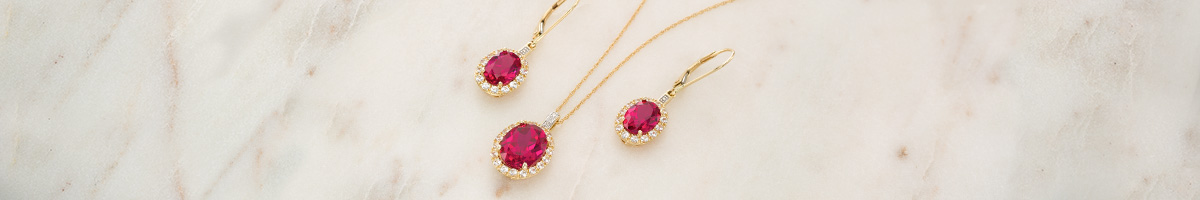 A set of stunning, fiery-red, ruby earrings and pendant.